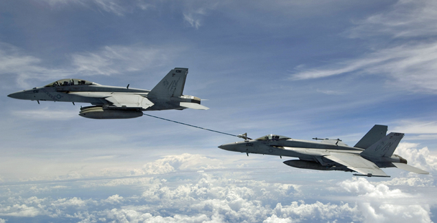 An F/A-18F two-seat Super Hornet refuels an F/A-18E Super Hornet over the Bay of Bengal in 2007